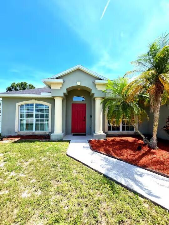 Photo of 302 NE Greenbrier Avenue, Port Saint Lucie, FL 34983 (MLS # B26059924)