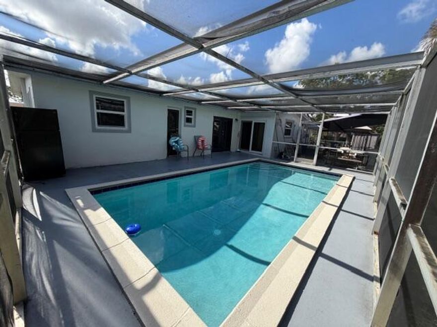 Excellent opportunity in West Palm Beach. This property features 3 bedrooms and 2 full bathrooms, one of them with direct access to the pool, offering added convenience and comfort. The home has been recently remodeled, with brand new flooring throughout the entire house installed just 6 months ago. Bright, Conveniently located near major roads, shopping, and services. Submit your best offer — this property has great potential.
