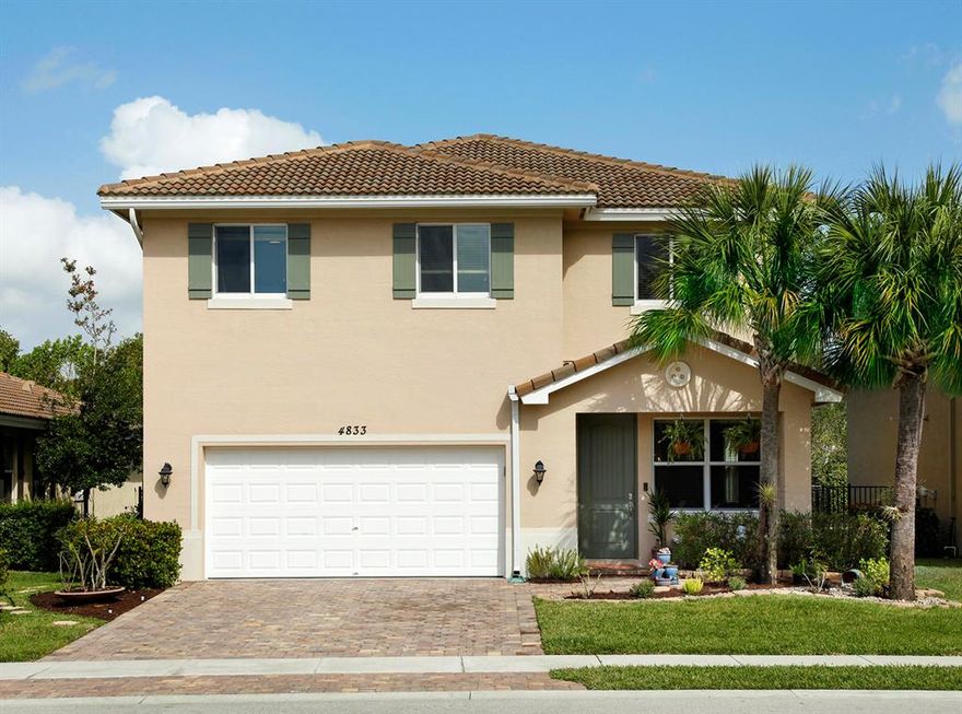 MOTIVATED SELLER...! Enjoy newer 2 story construction in the family neighborhood of Verona Estates. Beautifully landscaped with a welcoming entry porch, this spacious home has architecturally clean lines and a contemporary flow. This particular home has an extended floor plan that adds valuable living sq.ft. to an upgraded open kitchen, eating area and family room. One of 5 bedrooms is downstairs with the Master Suite up. Storage space abounds with a pantry, laundry room, spacious closets and large walk-in master closet. Very clean and move in ready. Live an easy lifestyle while the HOA fee covers your lawn maintenance and hedge trimming.