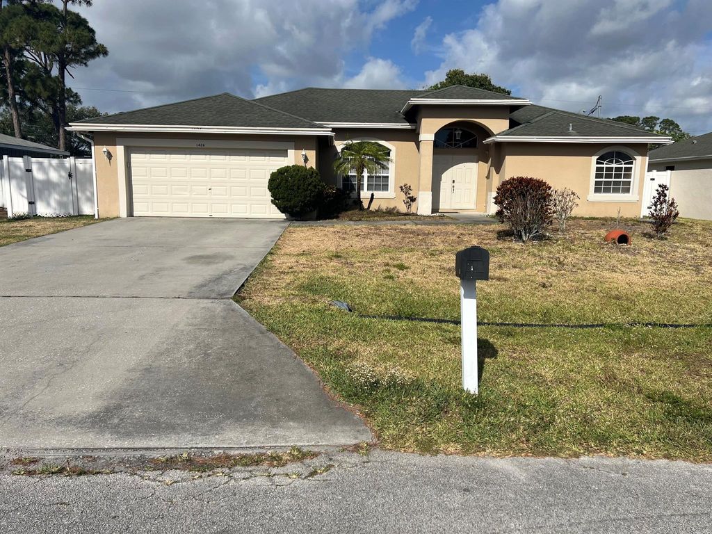 Photo of 1426 SE Navajo Lane, Port Saint Lucie, FL 34983 (MLS # R10987547)