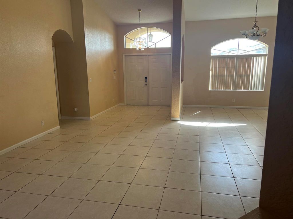 Photo of 1426 SE Navajo Lane, Port Saint Lucie, FL 34983 (MLS # R10987547)