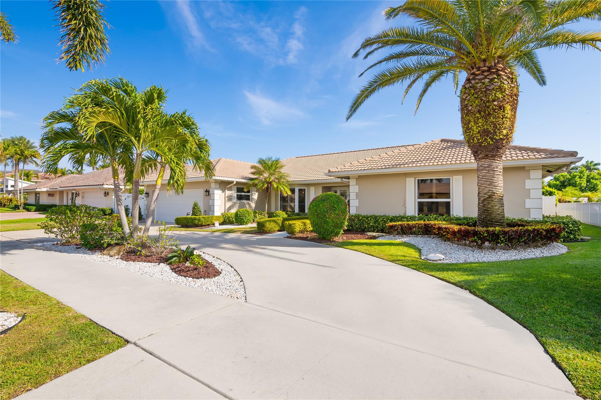 This stunning deep-water home is a boater's paradise with southeast exposure and a 120-foot deep lot, perfect for Florida's beach lifestyle. The spacious single-story residence includes 3 bedrooms, 2.5 baths, and generous living areas that highlight breathtaking water views. With 90 feet of waterfront, a new seawall, and dock, it's ideally positioned off the Intracoastal, just minutes by boat from two inlets. Luxury features include marble floors, high-impact windows, and a full home generator with an automated transfer system. Located near Deerfield's beach and Downtown Boca, this home offers the best of waterfront and city living.