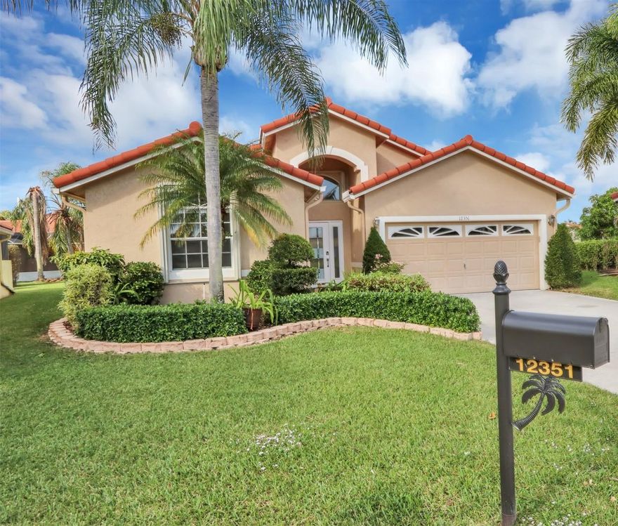 Fabulously updated home in the wonderful community of Starlight Cove, a subdivision of Westchester Country Club. This move-in ready, single story home features a new roof, updates galore with a fantastic lake view on a quiet cul-de-sac street. You'll appreciate the neutral tile throughout, freshly painted interior and open floor plan. The renovated kitchen is a chef's dream - offering wood cabinetry, granite countertops, lighted glass display cabinets and stainless steel appliances. There is a large breakfast nook as well as a formal dining space - perfect for entertaining! The multiple windows in this home, with modern window coverings, allow for fantastic natural light and stunning views of the lake. The master bedroom is a true retreat - offering gorgeous lake views plus dual walk-in closets. The brand new master bathroom is a spa-like oasis; featuring all new cabinetry, Kohler fixtures, top of the line tile and quartz, a luxurious oversized shower plus soaking tub. The additional bedrooms are very nicely sized, with wonderful closet space and loads of natural light, with one offering built-in cabinetry for extra storage or home office space. The second full bath has also been updated with all new fixtures, cabinetry and tile. This home offers an expansive pie-shaped, private lot with tropical landscaping, and a large screen-enclosed back patio - the perfect spot for watching the sun set over the lake! Additional features include accordion storm protection, new impact glass front door, keyless entry lock, lake-fed sprinklers and so much more! Located in beautiful Boynton Beach, Starlight Cove at Westchester Country Club offers it's residents an affordable monthly fee that includes cable and internet, a community pool, walking trail plus excellent golfing at this non-membership, open to the public course.