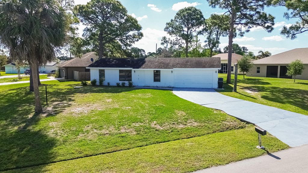 Photo of 993 SW Cecil Lane, Port Saint Lucie, FL 34953 (MLS # B26019688)