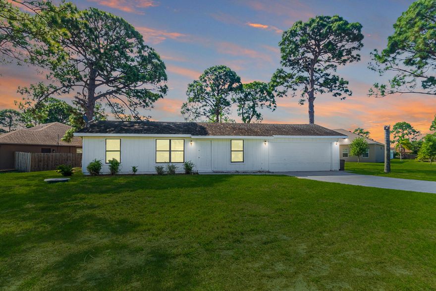 Freshly updated and move-in ready, this 2BR + flex space, 2BA corner-lot home blends comfort, versatility, and convenience. Bright, open living with tile flooring throughout and fresh interior/exterior paint creates a clean, modern feel. The versatile flex area is ideal for a home office, den, or guest space. Enjoy a covered, screened-in porch—perfect for relaxing or entertaining year-round. Added value with a newer 2023 water heater and an oversized 2-car garage with washer/dryer. Centrally located near shopping, dining, entertainment, medical facilities, and easy highway access. Schedule your showing today!