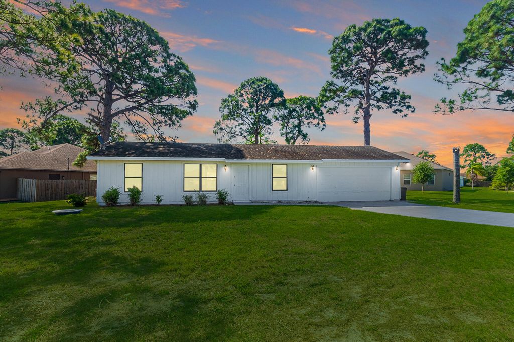 Photo of 993 SW Cecil Lane, Port Saint Lucie, FL 34953 (MLS # B26019688)