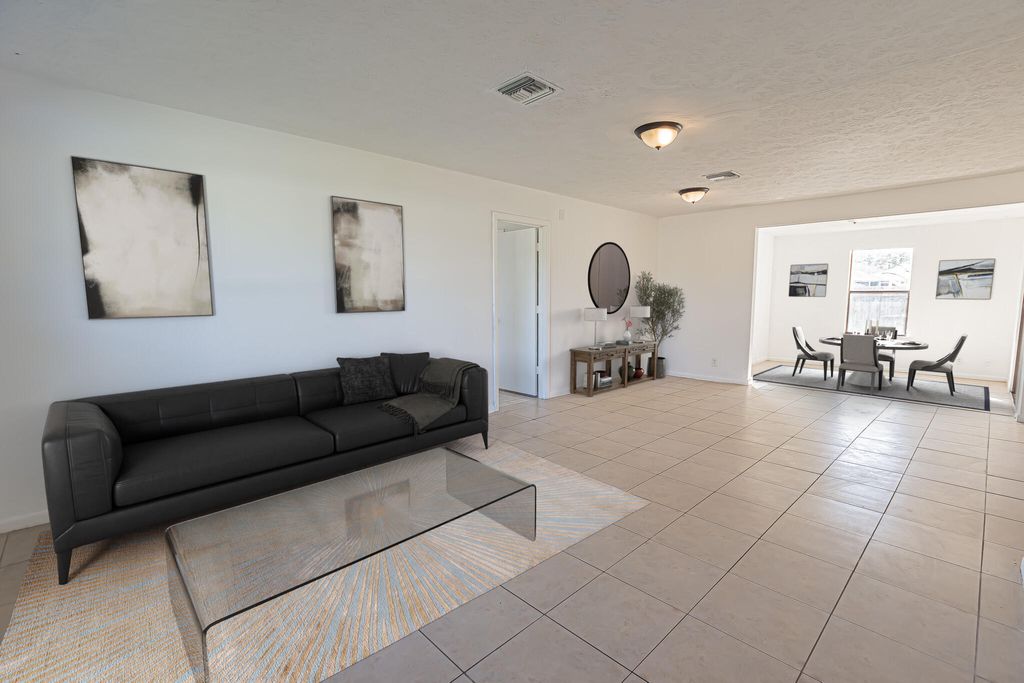 Photo of 993 SW Cecil Lane, Port Saint Lucie, FL 34953 (MLS # B26019688)