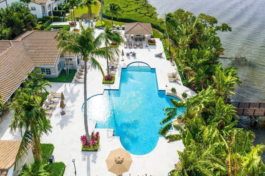 Welcome to the intracoastal gated community Highland Beach Club!  Immaculate 2nd floor 2 BR/2 BA condo features a split BR floor plan, covered terrace, newer A/C and marble floors on the diagonal in main living area. NO carpet! Great sized open kitchen with newer refrigerator and large breakfast bar. Laundry room/pantry with full size washer and dryer is perfect for extra storage. Master bedroom has 2 walk in closets, oversized bathtub and linen closet. Huge 2nd BR also has large walk in closet and shares guest bathroom. All closets are fitted for maximum use of space.This unit is spacious and bright and extremely well maintained. Water, cable and internet included in condo fee. No waiting period to rent and pet friendly! Private beach, all age community.Highland Beach Club is a true