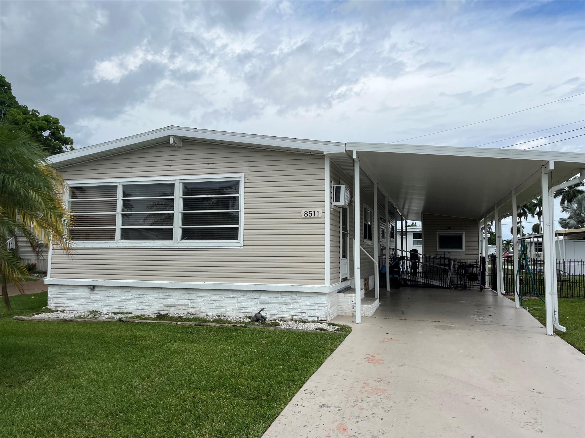 Beautiful spacious 2 bedroom with Florida room that could be an office or 3rd bedroom. New vinyl faux wood floors. New roof 2.5 years old. Central A/C Nice concrete driveway and carport to park under. Dog fenced area. Nice quite section of the park near the main pool and clubhouse. Whirlpool jet walk in bath tub.