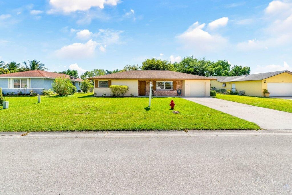 Photo of 144 Sandpiper Avenue, Royal Palm Beach, FL 33411 (MLS # R10970549)