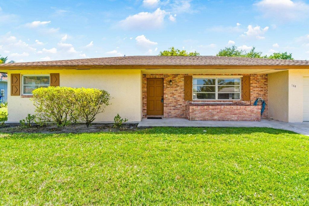 Photo of 144 Sandpiper Avenue, Royal Palm Beach, FL 33411 (MLS # R10970549)