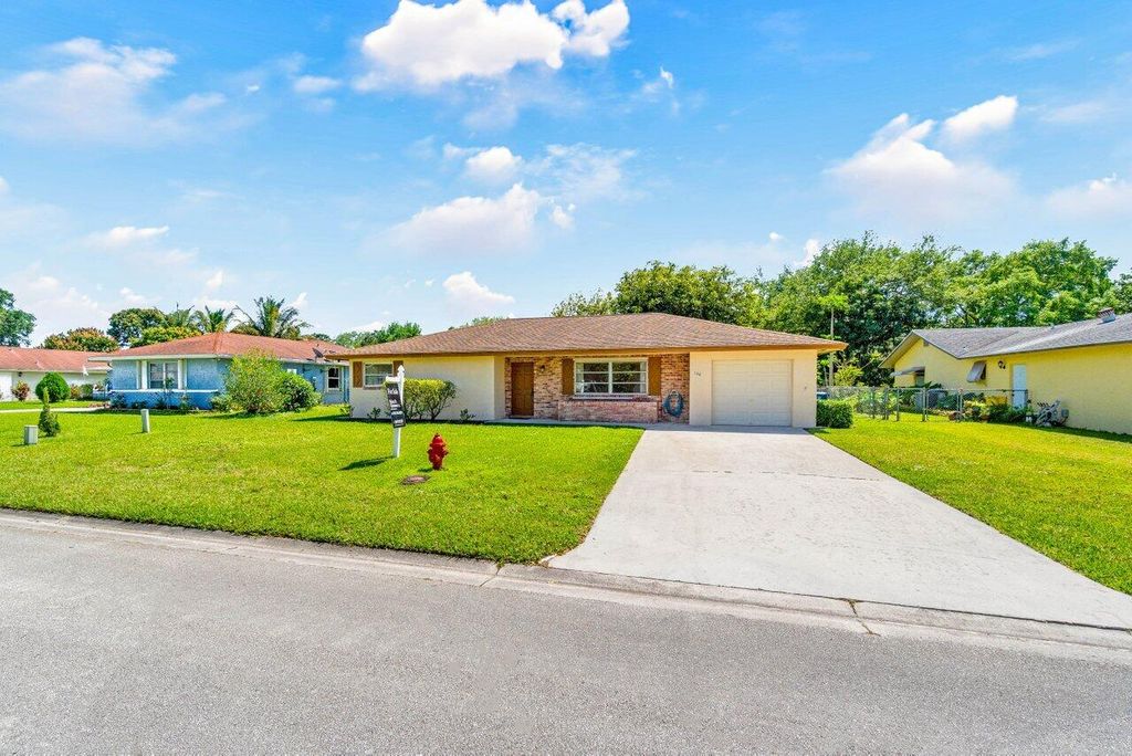Photo of 144 Sandpiper Avenue, Royal Palm Beach, FL 33411 (MLS # R10970549)