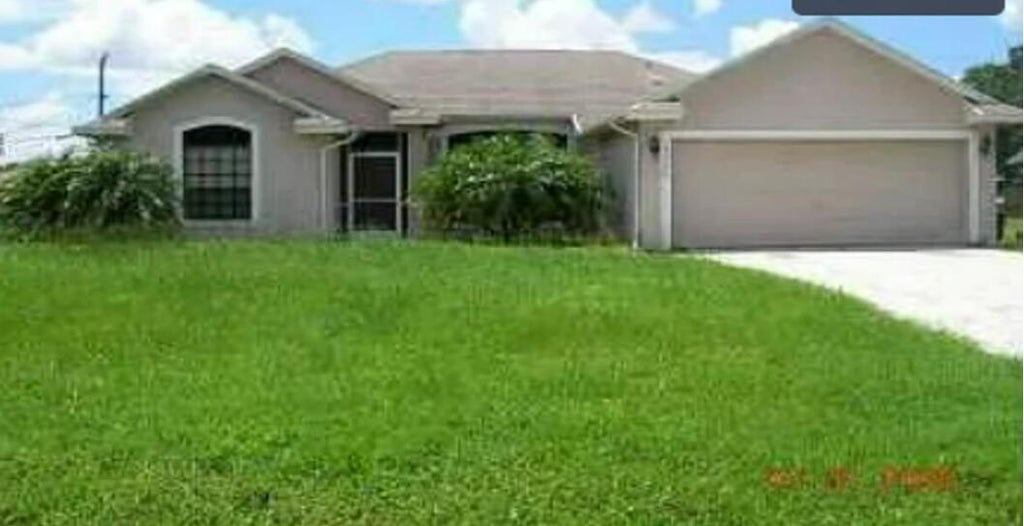 Photo of 1122 SW Bayamo Avenue, Port Saint Lucie, FL 34953 (MLS # R11043062)