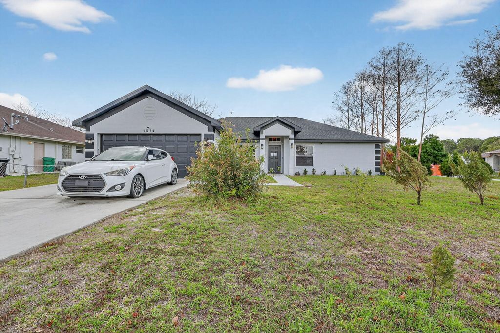 Photo of 1574 SW Fresno Road, Port Saint Lucie, FL 34953 (MLS # R11168808)