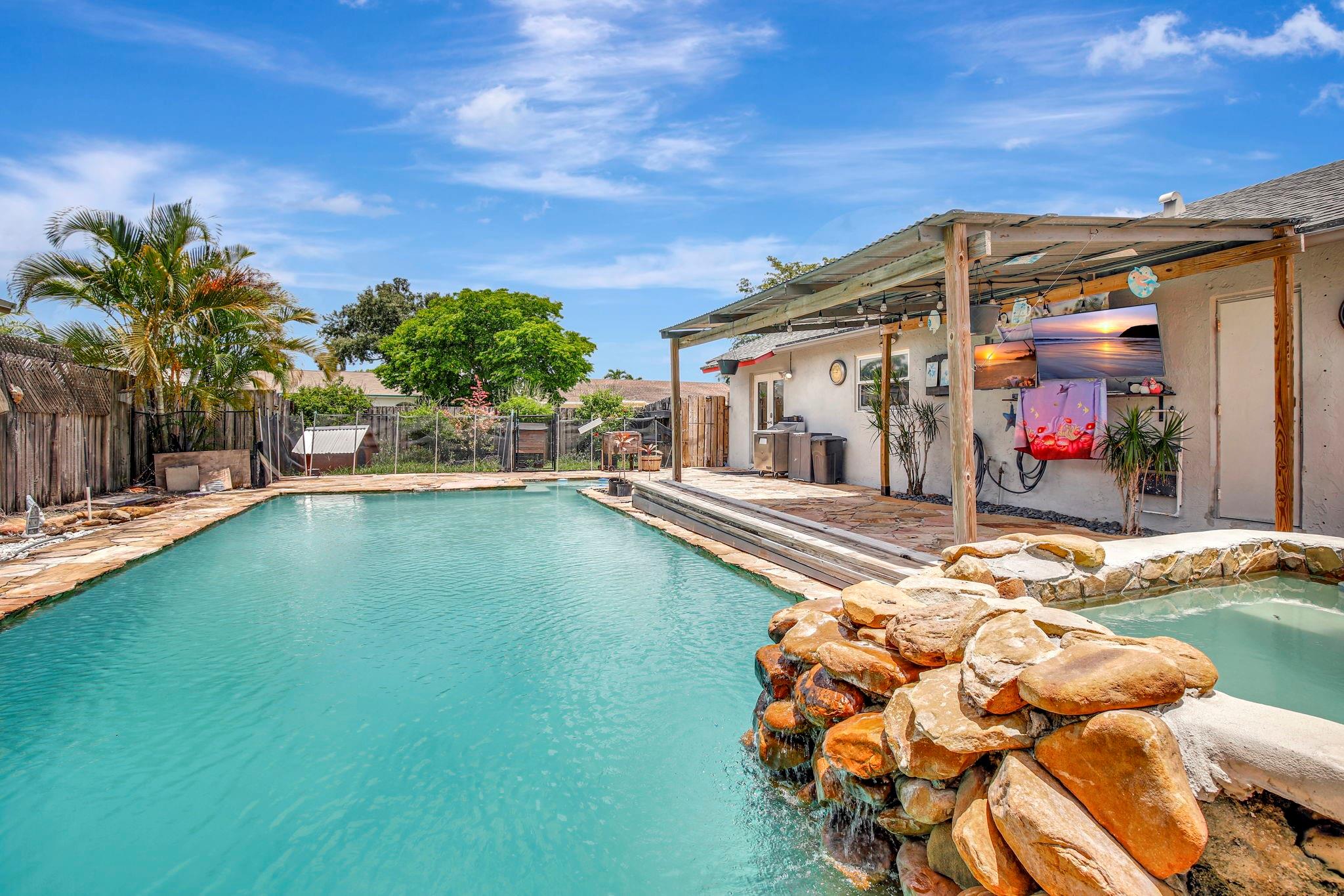 This 3/2 single-family home on a spacious corner lot in a great neighborhood features a heated pool and spa—perfect for someone ready to make it their own. Ideal for buyers seeking a renovation project, the home offers solid bones with PVC and copper piping, a 5-year-old AC, 10-year-old water heater, and a roof with approx. 5 years of remaining life (per inspection). The garage has been partially converted to living space, with easy potential to restore it to a full 2-car garage. Bring your vision—this home is full of potential!