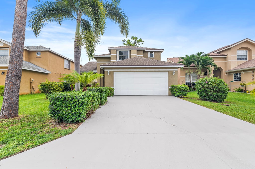 Photo of 133 Heatherwood Drive, Royal Palm Beach, FL 33411 (MLS # R11046948)