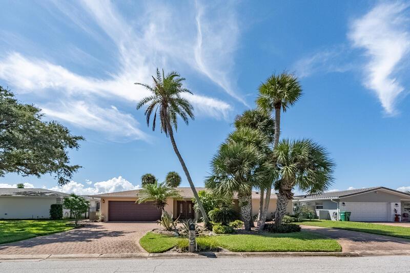 Own Your Own Slice of Paradise! This custom-remodeled waterfront home offers the ultimate Florida lifestyle, nestled on a wide, deep-water canal with direct access to the Banan River. Step outside to your private oasis featuring a free-form pool and spa overlooking a boat dock equipped with a 12,000 lb boat lift, power, and fresh water. Inside, you'll find an expansive 30 x 14' family room filled with natural light-perfect for entertaining or relaxing with a view. The family-style kitchen features granite countertops, stainless steel appliances, and rich cherry all-wood cabinetry. Host dinners in the spacious guest bedrooms on the north wing, while the private primary suite is tucked away on the south wing-offering peace and privacy. All bedrooms are sized with large windows.