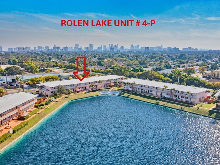 LOOKING FOR A WATERFRONT UNIT? Open the front door of this unit and you will see the " BLUE WATER " from THE LAKE! This fantastic GROUND FLOOR unit is selling FURNISHED TURNKEY! OPEN KITCHEN with new VENEER WOOD POLYESTER cabinets, GRANITE Countertop & newer appliances. New plumbing and lighting fixtures throughout the unit. NEW WATER HEATER (2024). 13" tile ceramic floor. Large pantry inside the unit. Cozy new dining table set (2024). Gorgeous new REMODELED NEW BATH. Two wall a/c (2021). Spacious bedroom well furnished with wall-to-wall mirror closet doors that led to private terrace with BBQ. Shutters on all openings. Great 55 + community with clubhouse, pool, gym, library, billiard, bocce, pétanque, and more. Cash only. Rent right away, seasonal only. Building with large reserve.