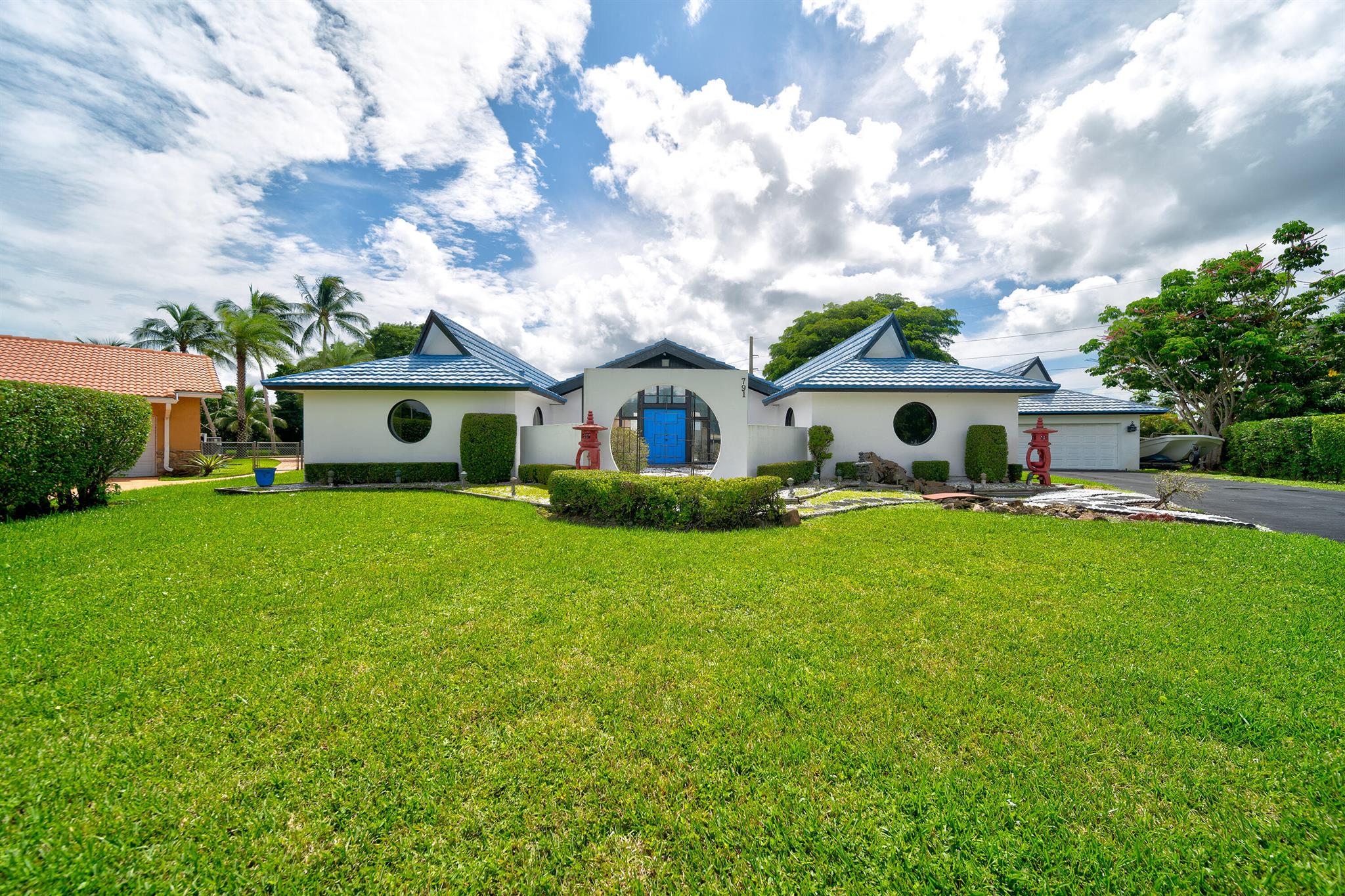 Architectural Gem with Asian-Inspired Design - A Rare Find!Discover this unique mid-century masterpiece, blending Asian architectural influences with timeless Japanese design. This meticulously maintained 5-bedroom, 4-bath residence offers vintage charm on a grand scale. From the iconic imported New Zealand blue metal tile roof to serene Zen gardens with waterfalls, this home is a peaceful sanctuary perfect for an upscale lifestyle or an exceptional investment.Situated on over half an acre at a prime corner lot, the property offers an intimate courtyard pool, creating an oasis of tranquility. The home's horseshoe layout seamlessly integrates indoor and outdoor spaces, emphasizing natural light and privacy. Inside, you'll find a private dining room, dedicated office space,