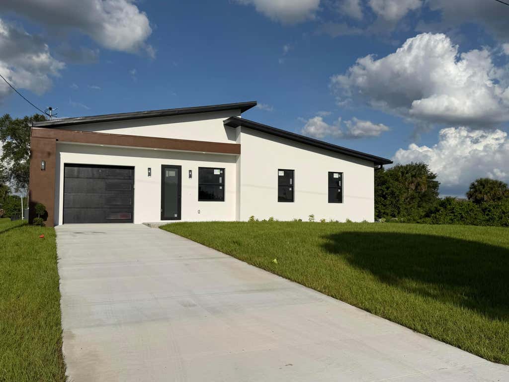 Photo of 515 Kingsbury Lane, Lehigh Acres, FL 33974 (MLS # B26033667)