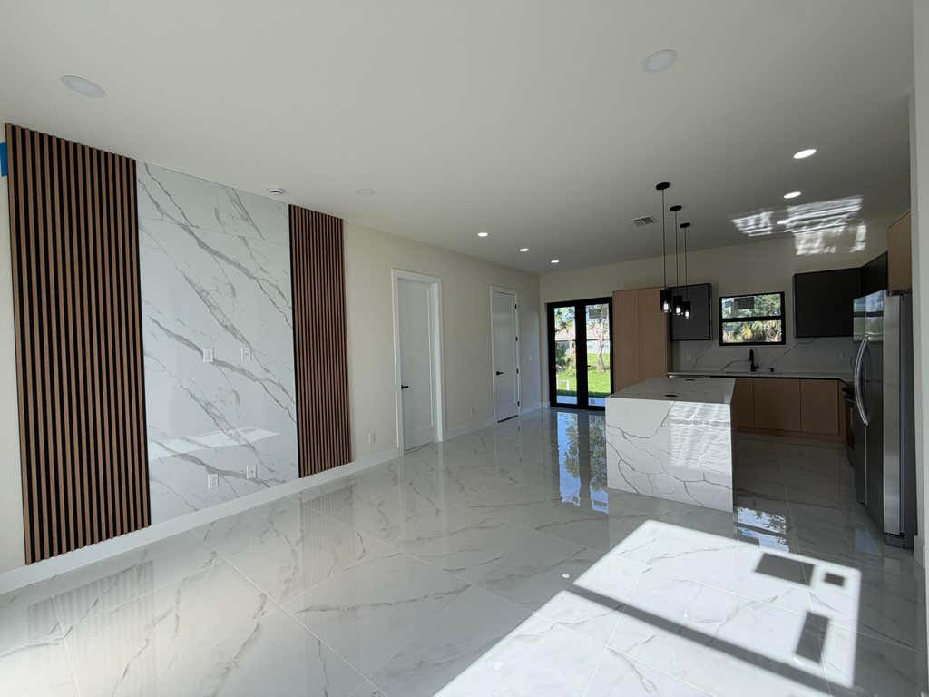 Photo of 515 Kingsbury Lane, Lehigh Acres, FL 33974 (MLS # B26033667)