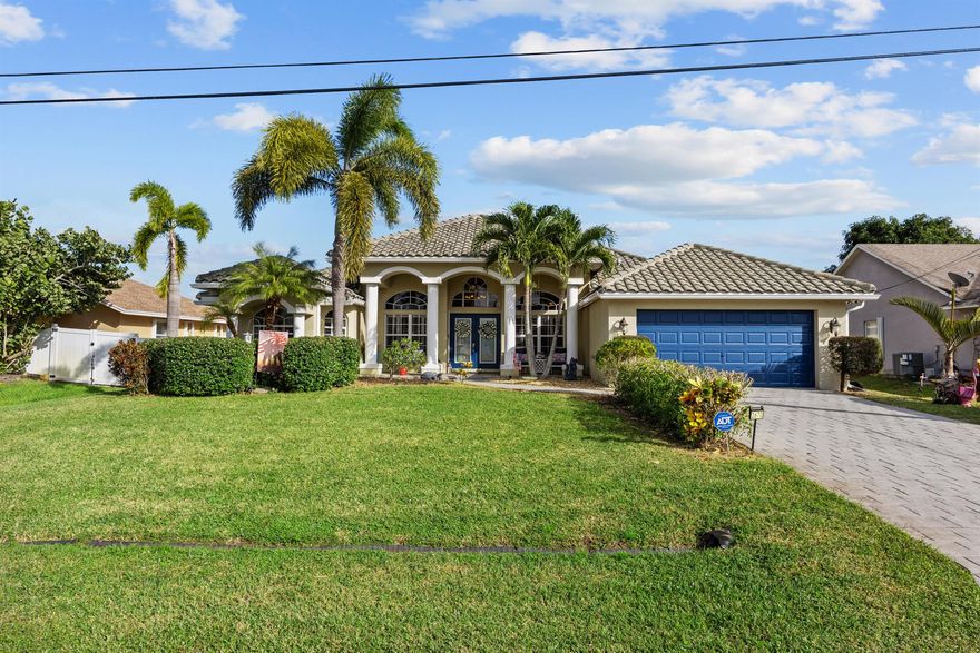 Welcome to 2670 SW Cadet Circle -- a beautifully maintained single-family home that blends Florida charm with everyday functionality. Inside, you'll find a bright, open layout that makes the space feel warm and inviting. Out back, a pool, tiki bar, and covered outdoor area set the stage for effortless outdoor living (yes, you can finally stop telling people you wish you lived in the tropics -- because you basically do). Situated on a generous lot, this home offers plenty of space, comfort, and convenience, all while being close to shopping, dining, and major roadways.