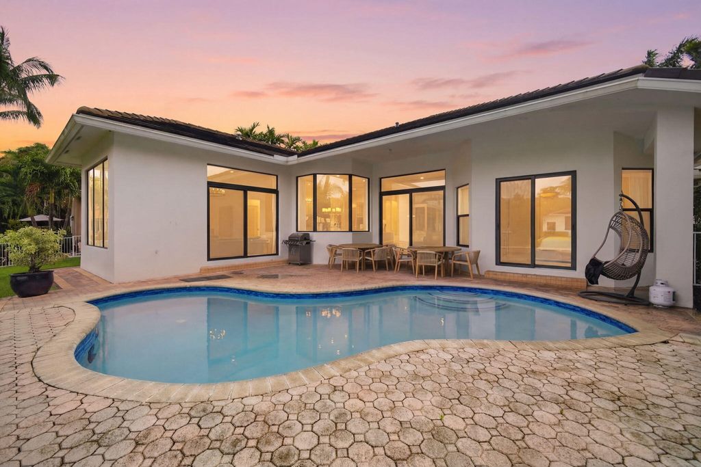 Photo of 10995 Whitehawk Street, Plantation, FL 33324 (MLS # B26003142)