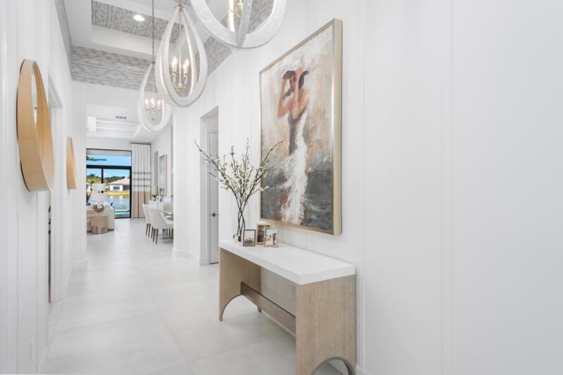 Rare opportunity to own the highly sought-after, designer curated fully furnished Venice Builder Model--luxury, location, and design in one. Situated on a premium lakefront lot w/ heated pool, spa, sun shelf, & summer kitchen. Features incl. a gourmet kitchen w/ oversized island, soaring ceilings, custom closets, designer window treatments, large-format porcelain tile,+ more. 3 Generous Bedrms, Plus Den/Office, Spacious Great Room, 31/2 Baths, Split 3-Car Garage, Heated Pool. Enjoy your private oasis + world-class amenities: full-service restaurant, 44,000 sq. ft. clubhouse with spa/salon, indoor/outdoor bar, indoor pickleball, tennis, multiple pools, & more. Closing cost incentives may apply-subject to change. Estimated delivery: 2nd quarter of 2026. Call for upgrade list & full details.