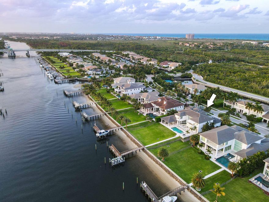 Palm Beach Gardens Waterfront! An Immaculate Custom-Built Luxury Estate home with high-end finishes throughout. Over 100' of Direct Intracoastal Waterfrontage and Private Dock! A boater's dream, this oversized waterfront lot comes equipped with a 45' dock that can house up to a 70' vessel and boasts a 38k pound lift. Located in the exclusive boating community of Frenchman's Harbor, this modern residence has 7 full bedrooms, 7 full bathrooms, 2-1/2 baths, a den/office, private elevator, extended loggia with outdoor kitchen, a heated saltwater pool and 3-car garage. The open-concept kitchen would easily house any chef with top-of-the-line appliances by Wolf and SubZero, marble countertops and oversized island. Exceptional water views from all living areas, this bright and open home has floor-to-ceiling impact glass, stunning marble flooring and soaring ceilings. Live walking distance to Florida's most pristine beaches with quick access to boating, water sports, fishing, fine dining and shopping. With the Jupiter inlet a mere 15 minutes away and the crystal blue waters of the Bahamas only 50 nautical miles away.