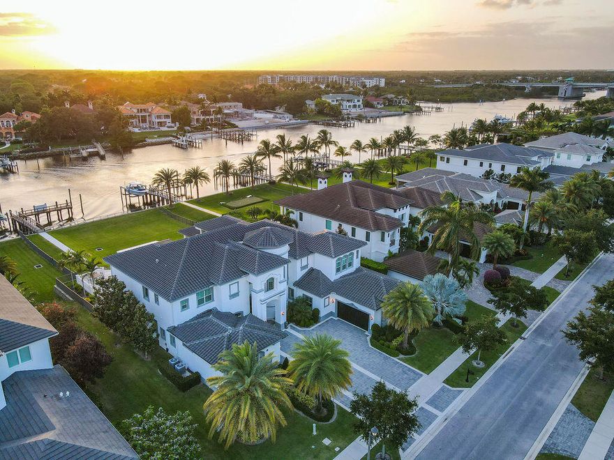 Palm Beach Gardens Waterfront! An Immaculate Custom-Built Luxury Estate home with high-end finishes throughout. Over 100' of Direct Intracoastal Waterfrontage and Private Dock! A boater's dream, this oversized waterfront lot comes equipped with a 45' dock that can house up to a 70' vessel and boasts a 38k pound lift. Located in the exclusive boating community of Frenchman's Harbor, this modern residence has 7 full bedrooms, 7 full bathrooms, 2-1/2 baths, a den/office, private elevator, extended loggia with outdoor kitchen, a heated saltwater pool and 3-car garage.