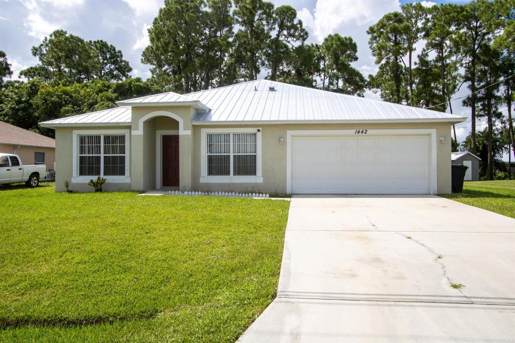 Photo of 1442 SW Medina Avenue, Port Saint Lucie, FL 34953 (MLS # R11020440)