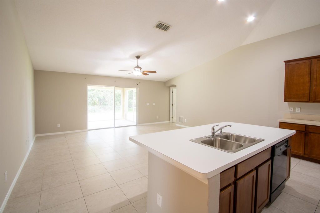 Photo of 1442 SW Medina Avenue, Port Saint Lucie, FL 34953 (MLS # R11020440)