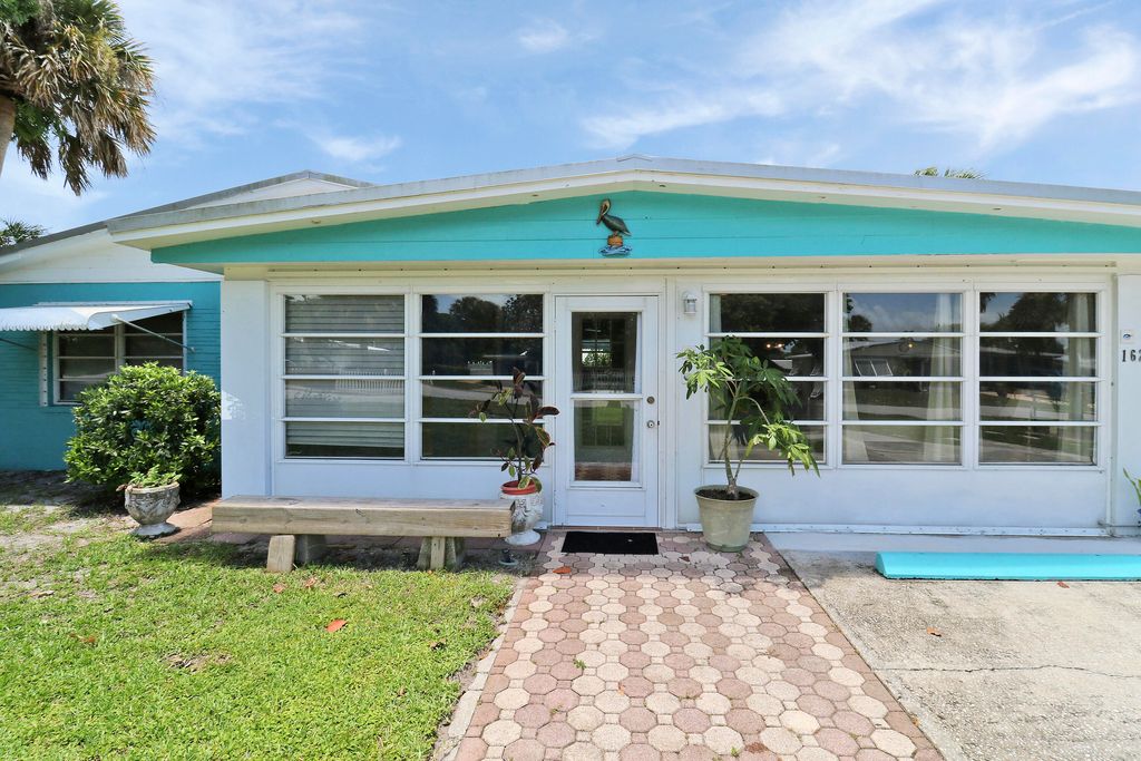 Photo of 1624 NE Orion Street, Jensen Beach, FL 34957 (MLS # R10998115)