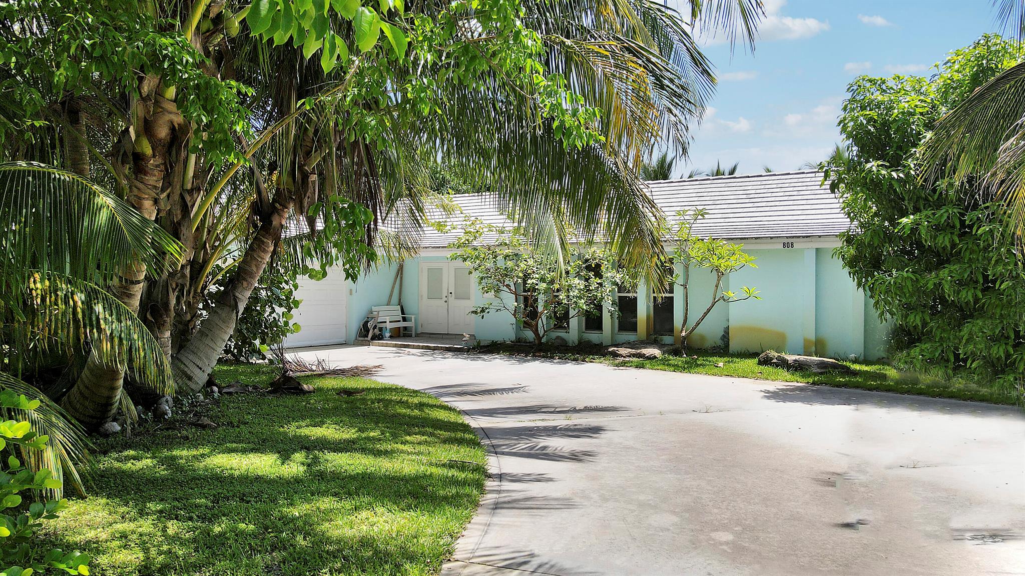 Located in the highly desirable Country Club Addition of the Village of North Palm Beach, this beautiful 4-bedroom, 2-bathroom ranch-style home offers the perfect blend of comfort, style, and prime location. Nestled just steps from the newly renovated North Palm Beach Country Club--featuring the signature Jack Nicklaus-designed golf course--this home provides an unmatched lifestyle in one of South Florida's most sought-after communities.Set on a generous 0.37-acre lot, the property boasts ample space to expand or even build new. Inside, the thoughtfully designed split bedroom floor plan is filled with natural light and offers a seamless flow throughout. The heart of the home is the open-concept kitchen, ideal for entertaining, which connects effortlessly