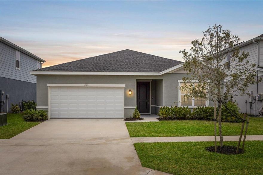 One of the LOWEST HOA's in 34987! Seller offering $2,500 CREDIT to replace carpets! Built in 2022, this well-maintained 3-bedroom, 2-bath home offers modern living with a peaceful lake view and an incredibly low HOA of approximately $30 per month. The open-concept layout features a bright living space that flows into the kitchen and dining area, ideal for everyday living and entertaining. The split floor plan provides privacy, with a spacious primary suite and two additional bedrooms perfect for guests, a home office, or family. Enjoy serene water views from the backyard along with newer construction, modern finishes, and energy-efficient features. Most importantly, all in a convenient location near Tradition, shopping, dining, and major roadways.