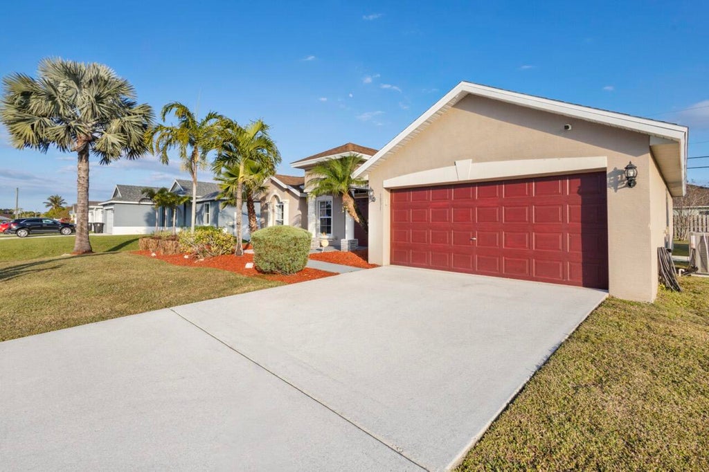 Photo of 1891 SW Lewis Street, Port Saint Lucie, FL 34987 (MLS # R11132089)