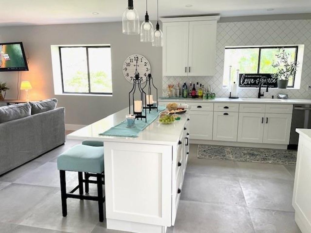 Photo of 1143 Duncan Cir #104, Palm Beach Gardens, FL 33418 (MLS # F10539732)