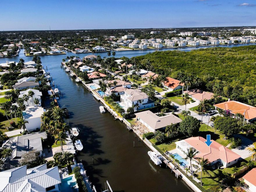 Welcome to your waterfront oasis in beautiful Ocean Ridge. This home comes to you fully furnished. It has been completely remodeled and sits on an intracoastal canal with 96 feet of water frontage, with a 48' Dock. The rear of this home boasts a well sunlit room which over looks a fully automated saltwater pool and spa. Both are on PILINGS. Surrounding your pool is imported stone decking, custom lighting,  a new dock and boat lift. This home has a new redesigned kitchen, with a Butlers Pantry with a wine fridge. The floors are porcelain wood plank tile and the bathrooms have been updated with modern vanities. Ocean Ridge is a quaint town on the barrier island, a real boaters paradise. When your not boating walk to the Ocean just across the street.