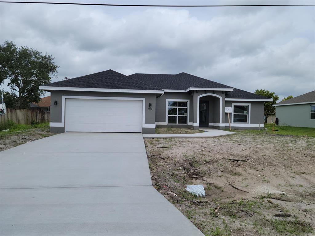 Photo of 5413 NW Bolin Street, Port Saint Lucie, FL 34986 (MLS # R10699033)