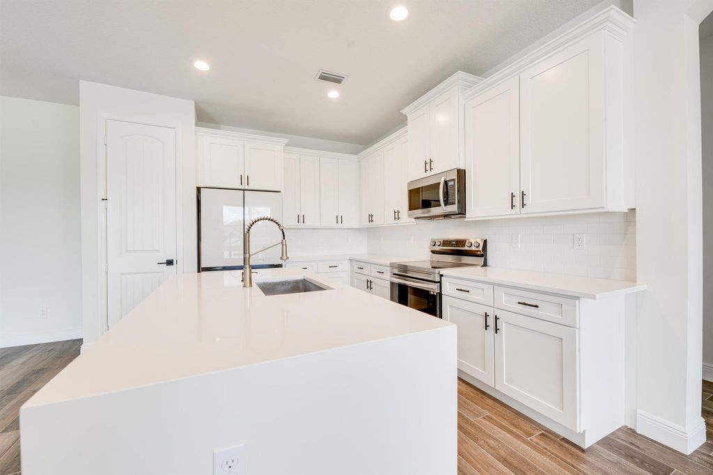 Photo of 3991 SW Wycoff Street, Port Saint Lucie, FL 34953 (MLS # R10985839)