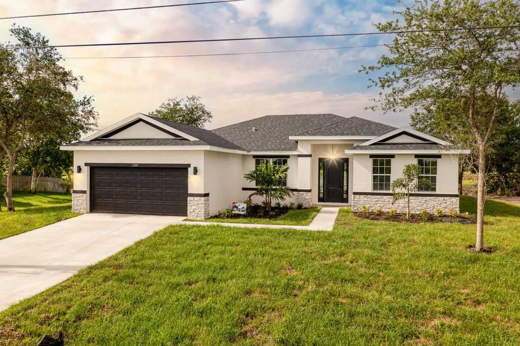 Photo of 3991 SW Wycoff Street, Port Saint Lucie, FL 34953 (MLS # R10985839)