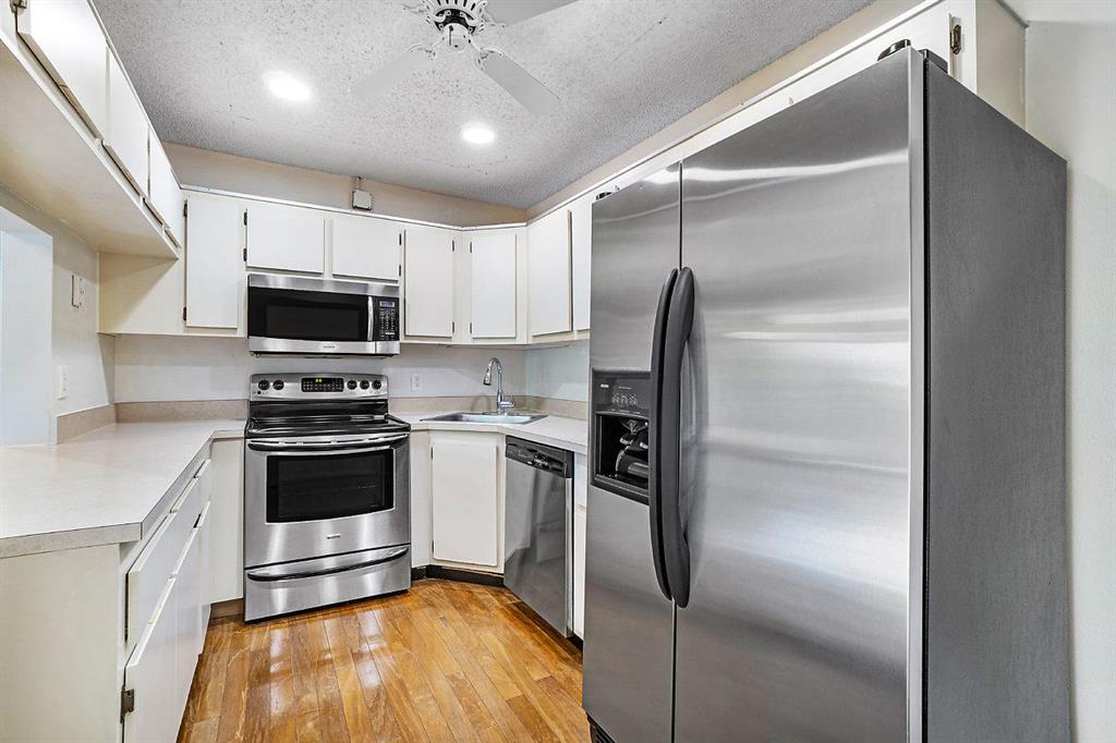 Rare to find! This beautifully updated 2 bedroom 2 bath condo features updated bathrooms, very well kept with stainless steel kitchen appliances, real hardwood floors, laundry room inside, covered screened balcony in a well-located 5 star community. All the main living areas have beautiful BAMBOO flooring & the kitchen is tiled. This lovely condo also has accordion shutters all the way around. DOGGY FRIENDLY!! Condo dues include water,sewer, trash, cable with HBO and 2 HD boxes, condo insurance, lawn care, exterior maintenance and all amenities. Pine Ridge offers 2 terrific satellite swimming pools. This wonderful neighborhood is close to golf, beaches, great restaurants, shopping, schools, highways, hospitals and more.