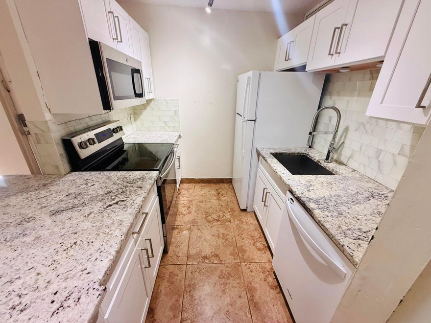 Beautifully updated 2 bedroom, 2 bathroom located east of 95 in desirable Boynotn Beach! Minutes driving distance to the beach! This move in ready unit features white cabinets, granite countertops, and beautiful subway tile backsplash. Master bath includes tasteful upgrades with a modern vanity and stylish walk in shower.  Community offers pool and 24/7 security. ATTENTION INVESTORS: No rental restrictions, can be rented right away.