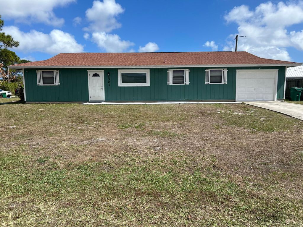 Photo of 1301 SW Empire Street, Port Saint Lucie, FL 34983 (MLS # R11169373)