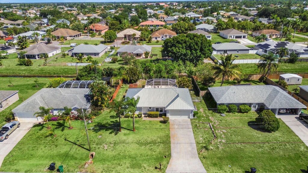 Photo of 509 SW Feldman Avenue, Port Saint Lucie, FL 34953 (MLS # R11125660)