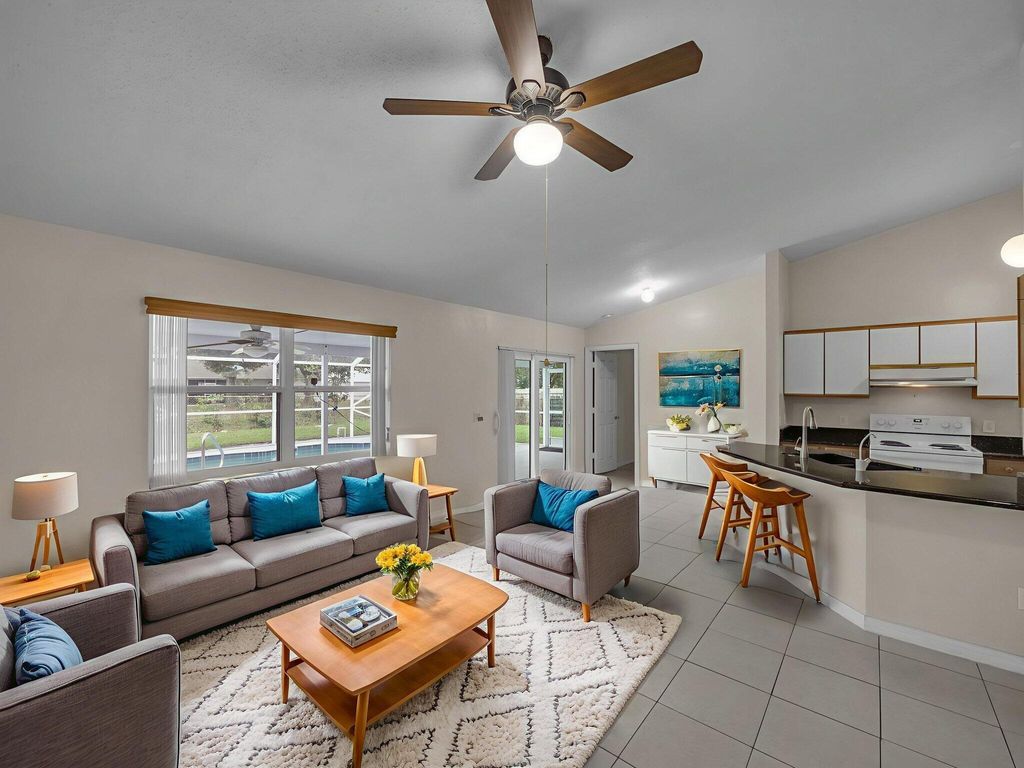 Photo of 509 SW Feldman Avenue, Port Saint Lucie, FL 34953 (MLS # R11125660)