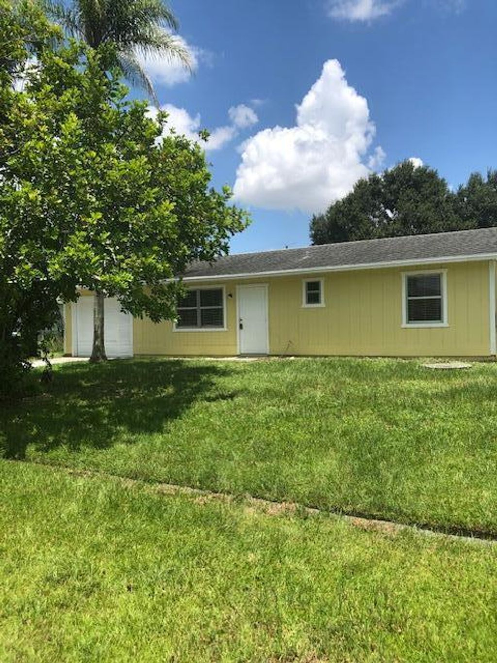 Photo of 1125 SW Colorado Avenue, Port St Lucie, FL 34953 (MLS # R10910594)