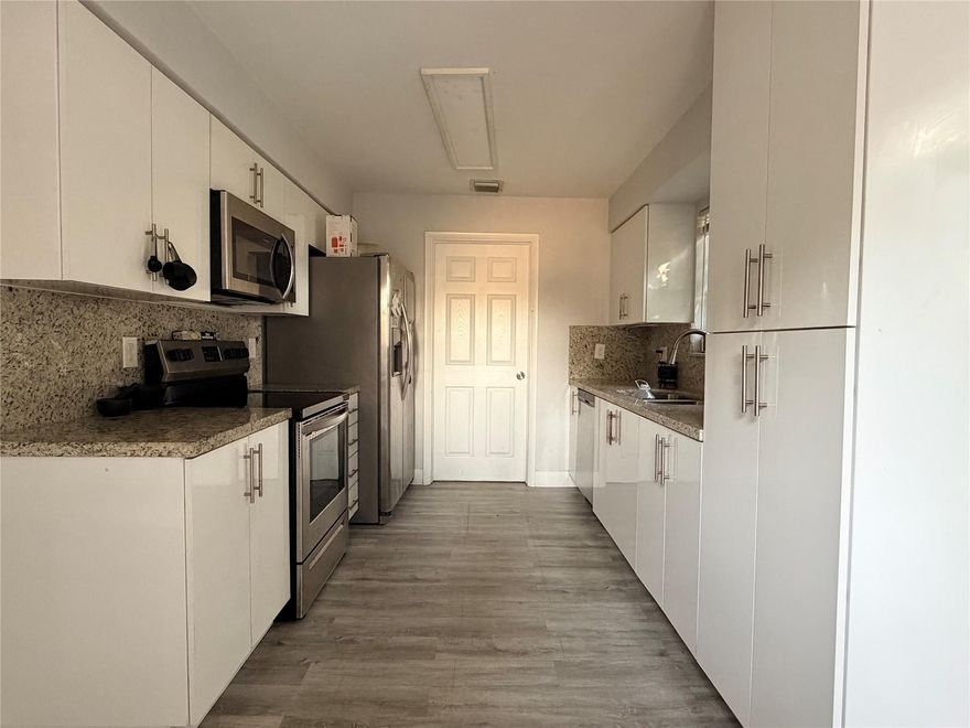 Beautifully updated 3-bedroom, 1-bathroom single-family home featuring modern finished throughout with strong rental appeal.  This bright and open residence offers a renovated kitchen with white shaker cabinets, granite countertops, and stainless steel appliances.  Stylish vinyl flooring flows throughout the living room, kitchen and bedrooms. The spacious living room is filled with large windows that admit a lot of natural light.  Home sits on a large plot of land with NO HOA!  Makes a great home for a family or perfect for investors looking for an income-producing opportunity in high demand Fort Lauderdale!