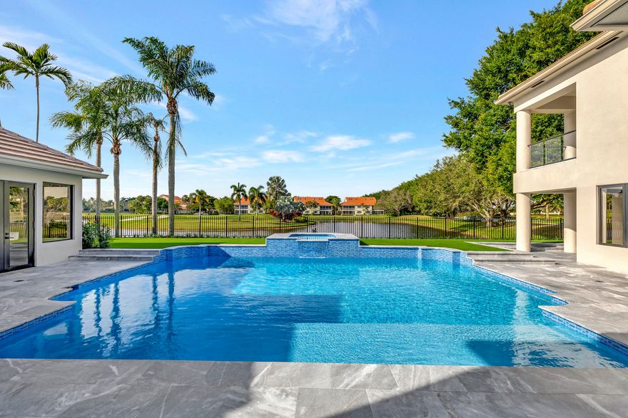 Photos containing furniture are virtually staged.  Welcome home to Broken Sound living at its highest caliber. With over 5000 sq ft, this stunning contemporary masterpiece boasts 6 beds, 6.5 baths, & separate guest house with sprawling lake and golf course views. The open concept luxurious great room features soaring 17ft ceilings, recessed LED lighting, 48X48 porcelain tiles and is protected by impact windows & doors throughout. The impeccably designed chef's kitchen is equipped with Thermador appliances, quartz counters, 15ft center island and state of the art wine display. The tremendous primary suite consists of 2 bedrooms, 2 baths, a free standing soaking tub, several walk in closets and private balcony with spectacular views. Enjoy outdoor living & entertaining on the oversized marble terrace, offering ultimate privacy & tranquility!

This is a spectacular home and it's waiting just for you!