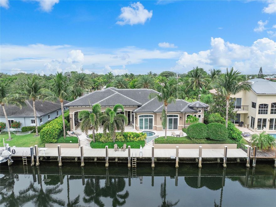 Custom-built, single-story waterfront estate offering exceptional construction quality and luxury living in Lighthouse Point. Located south of Sample Road, this deep-water property features 100’ of frontage on a 125’+ wide canal with direct ocean access and no fixed bridges, minutes to the Intracoastal and Hillsboro Inlet. Designed for longevity and refined coastal living, the home showcases 18’+ ceilings, marble floors, crown molding, and full-impact glass capturing expansive water views. The chef’s kitchen includes high-end appliances and custom cabinetry. With 4 bedrooms plus office and 4 baths, enjoy seamless indoor-outdoor living and coveted east-facing waterfront exposure. A rare opportunity for true deep-water luxury.